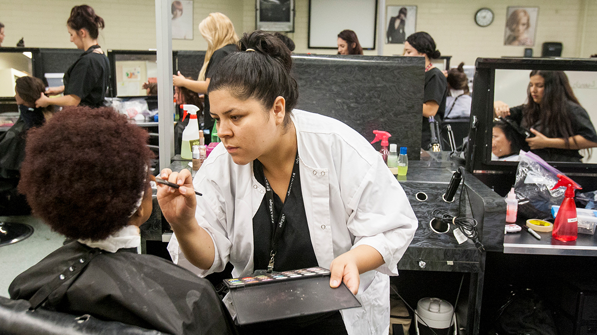 cosmetology dept students working on customers hair